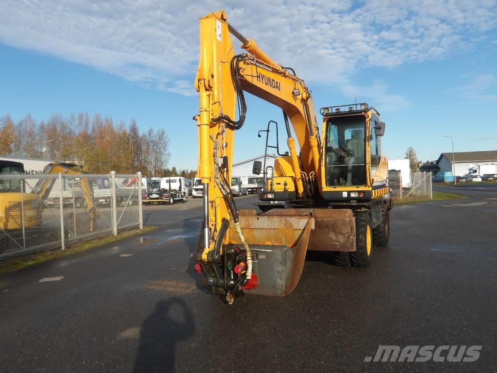 Hyundai R 140 W حفارات بعجل