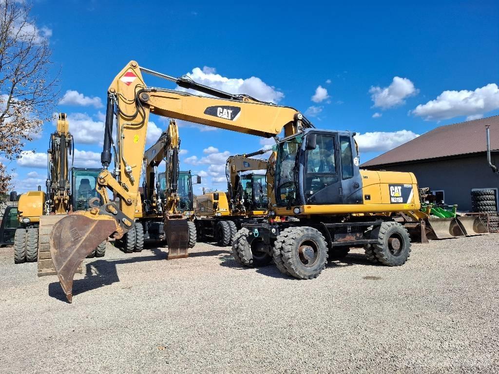 CAT 318 حفارات بعجل