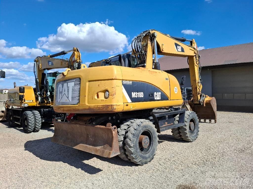 CAT 318 حفارات بعجل