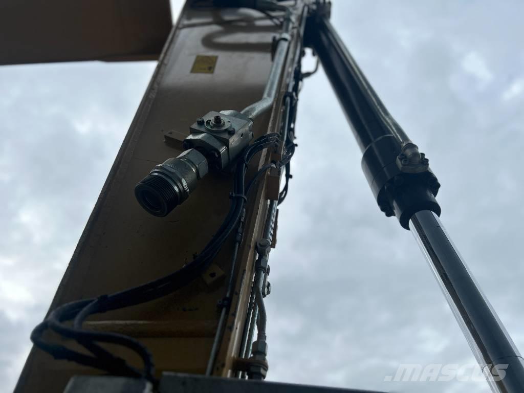 CAT M318F حفارات بعجل