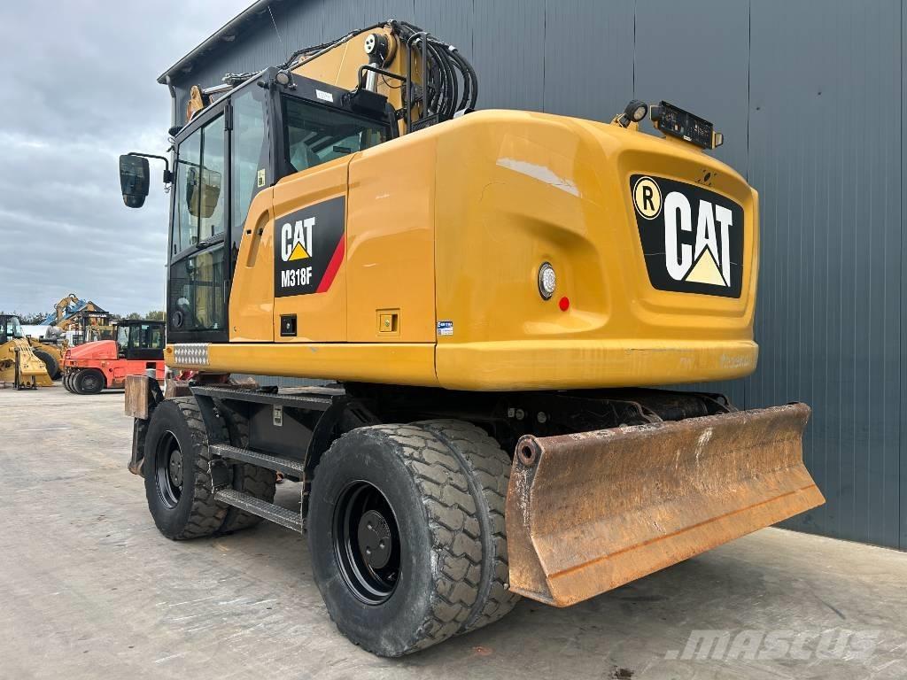 CAT M318F حفارات بعجل