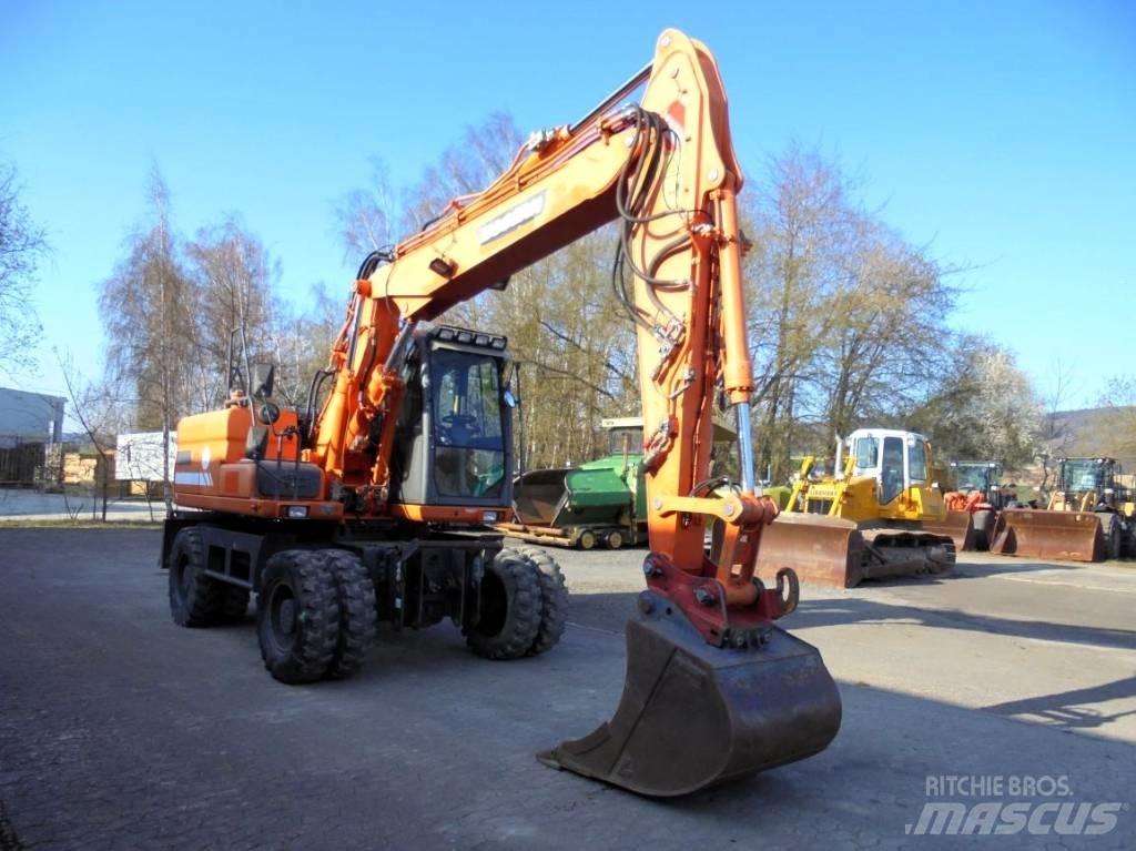 Doosan DX 160 W حفارات بعجل