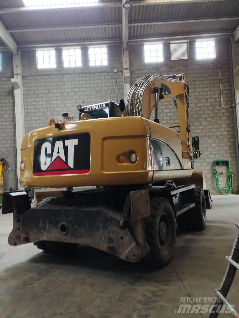 CAT M 316 D حفارات بعجل
