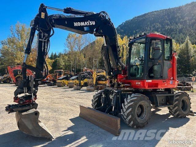 Komatsu PW 118 حفارات بعجل