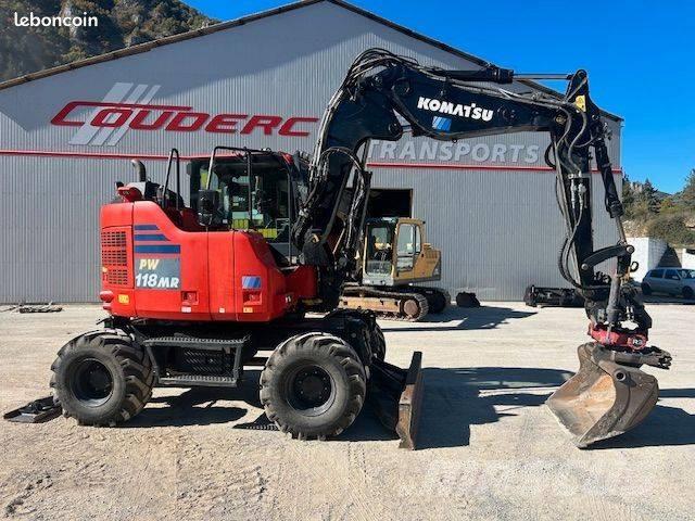 Komatsu PW 118 حفارات بعجل