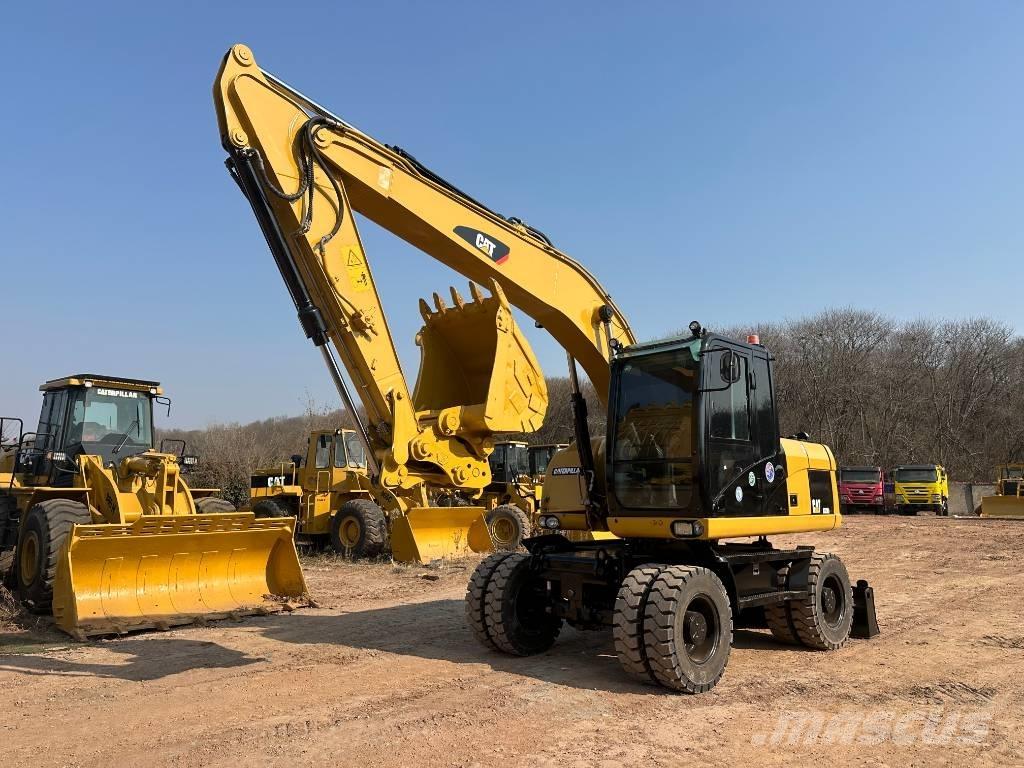 CAT M 320D حفارات بعجل