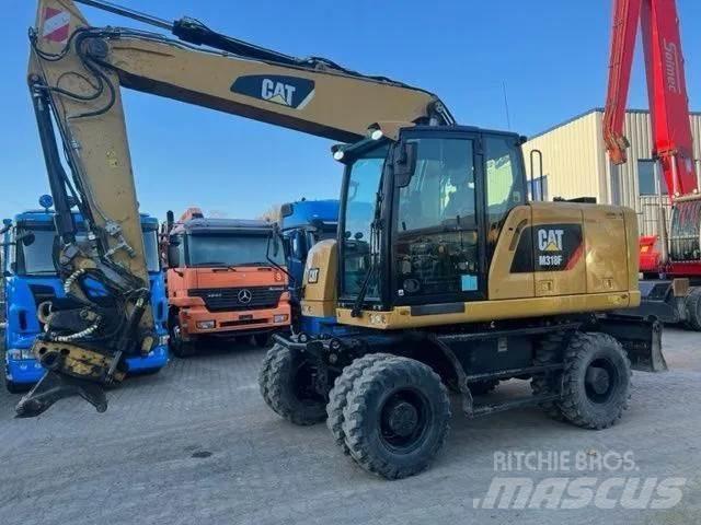 CAT M 318 F حفارات بعجل