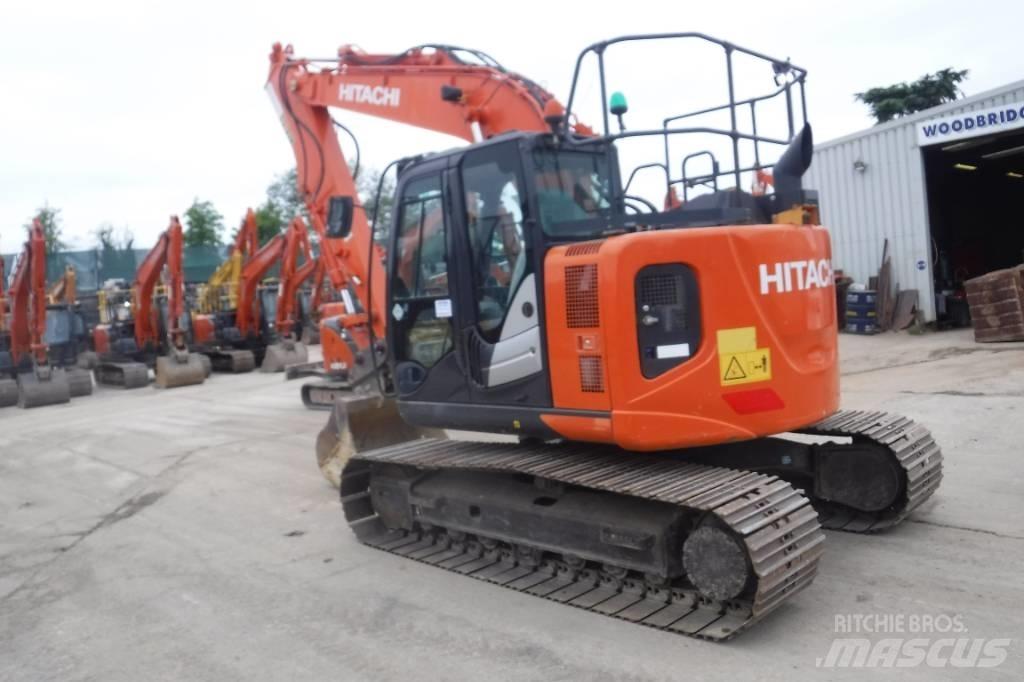 Hitachi ZX 135 US-6 حفارات زحافة