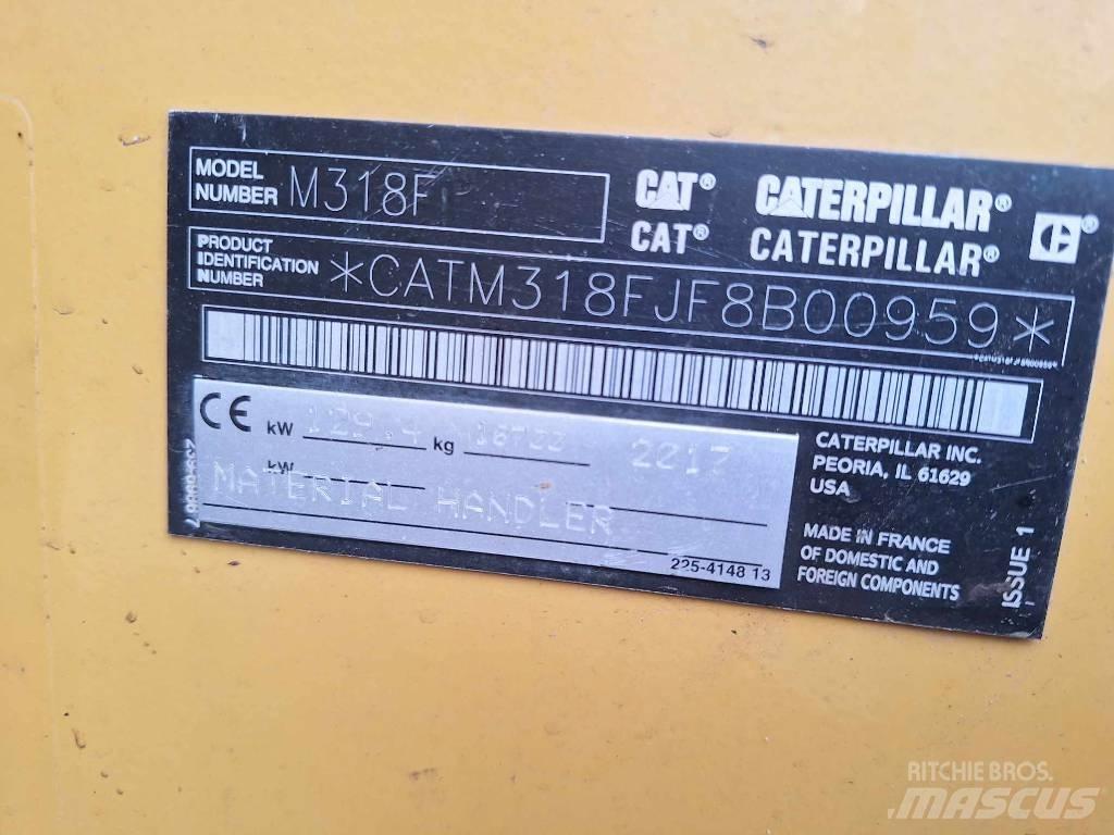CAT M 318 F حفارات بعجل