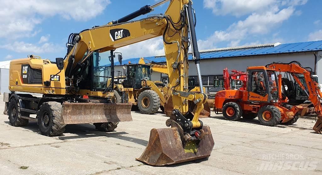 CAT M316F حفارات بعجل