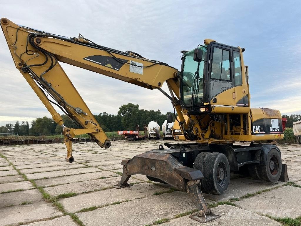 CAT M 316 C حفارات بعجل