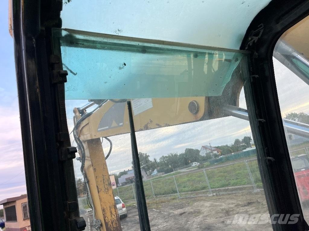 CAT M 316 C حفارات بعجل