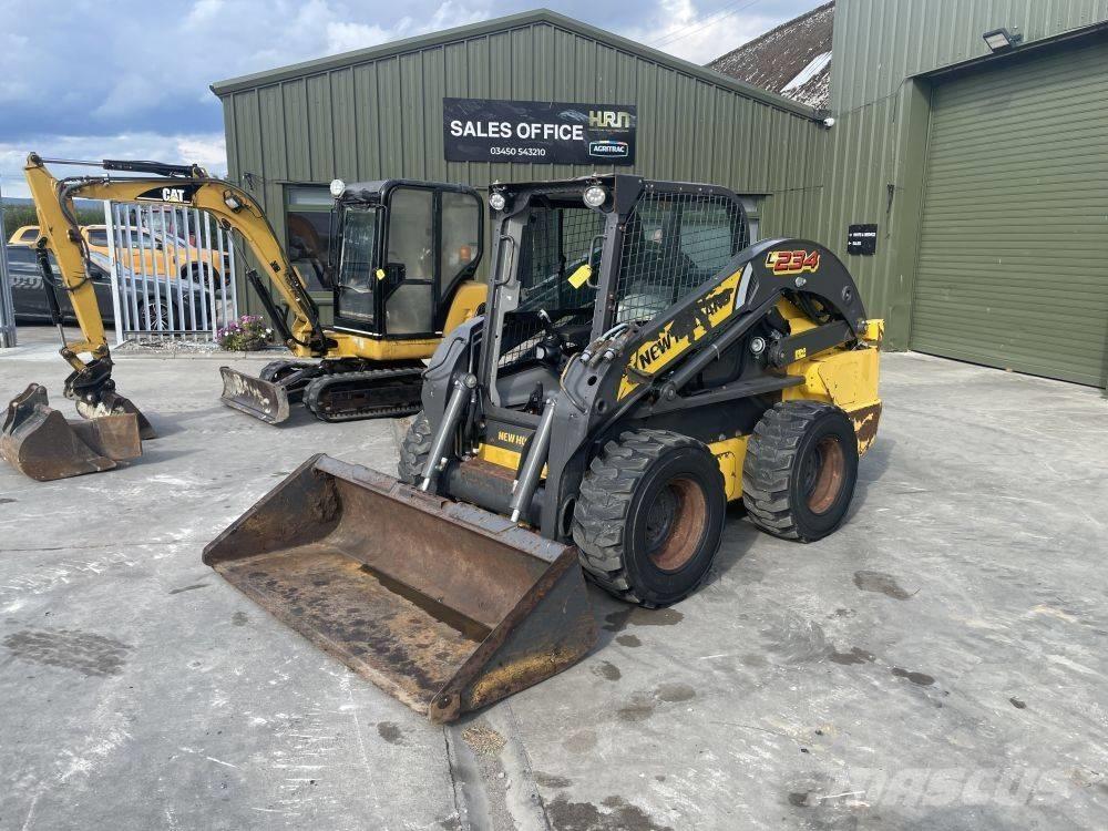 New Holland L 234 لوادر انزلاقية التوجيه