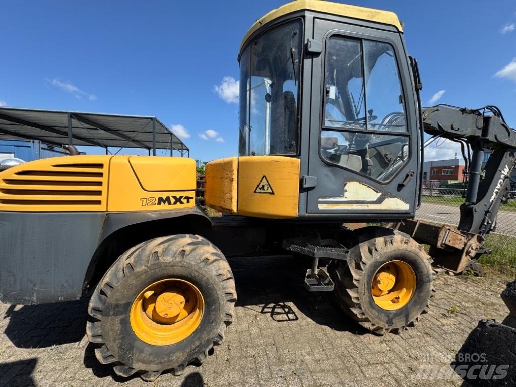 Mecalac 12 MXT حفارات بعجل