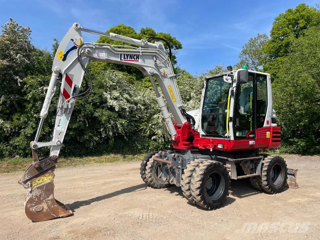 Takeuchi TB 295 W حفارات بعجل