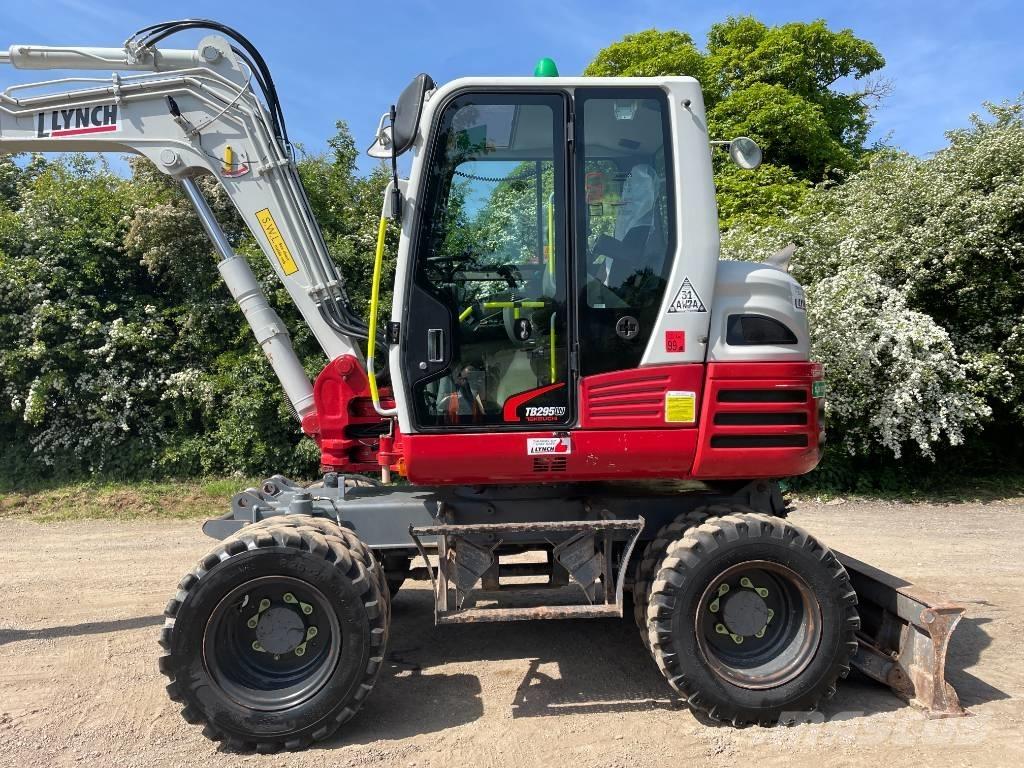 Takeuchi TB 295 W حفارات بعجل
