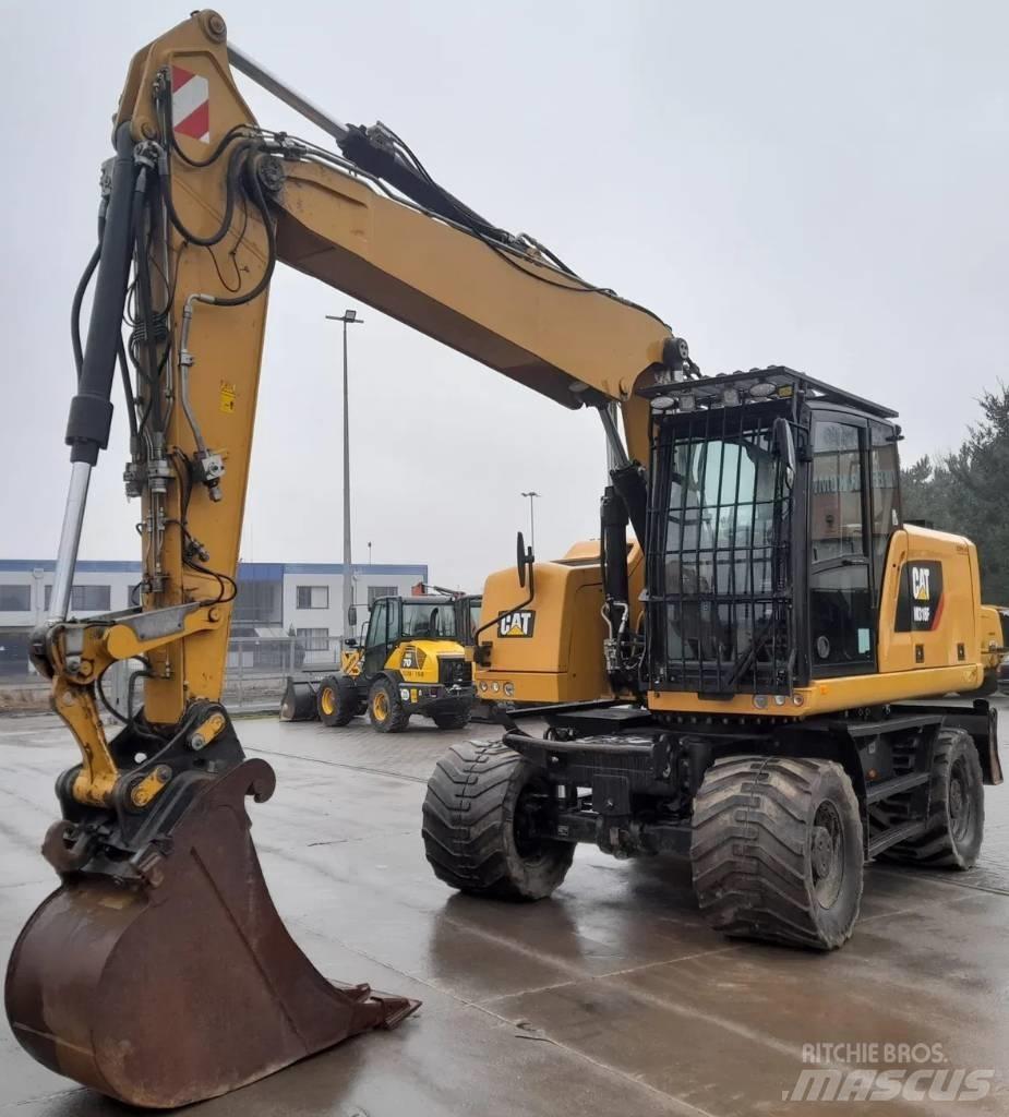 CAT M 318 F حفارات بعجل