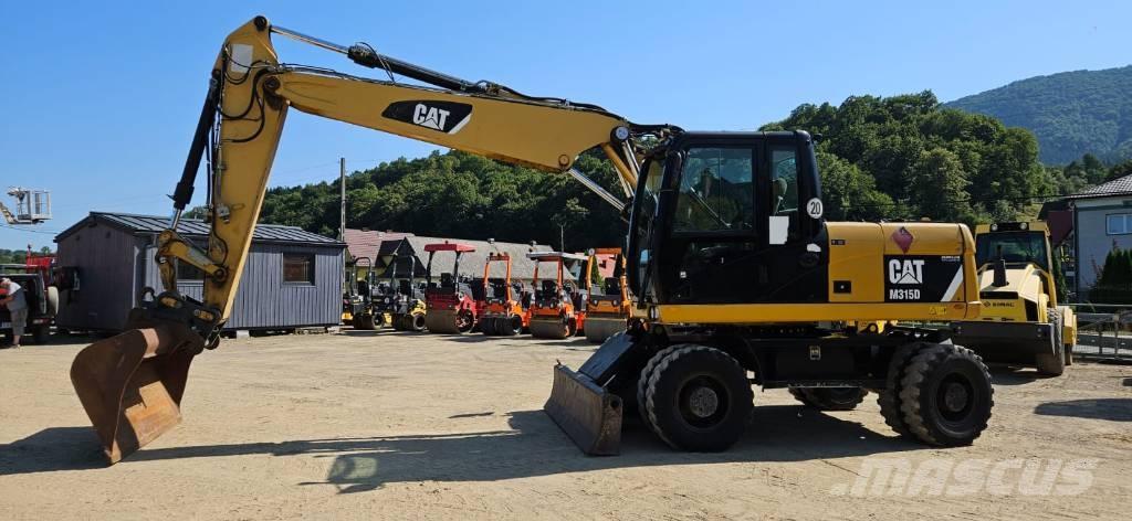CAT M 315 D حفارات بعجل