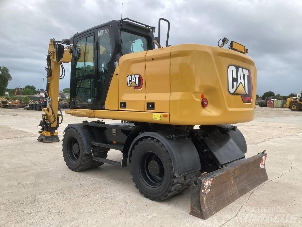 CAT M 314 حفارات بعجل