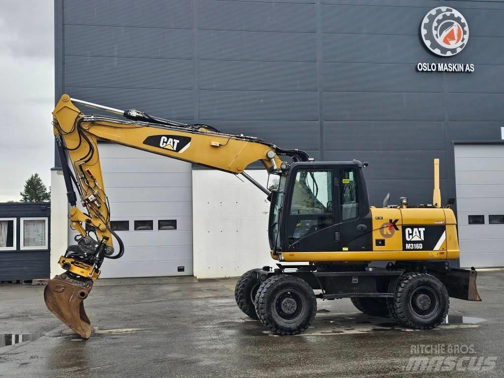 CAT M 316 D حفارات بعجل