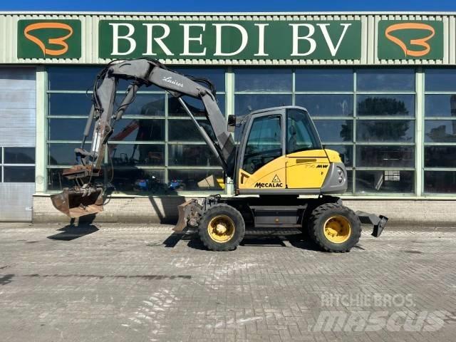 Mecalac 714 MW حفارات بعجل