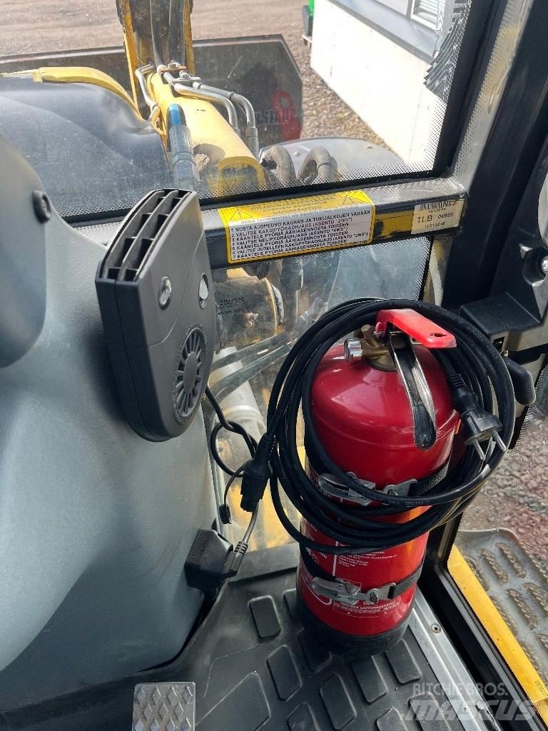New Holland B 115 B لوادر ذات جرافات عكسية