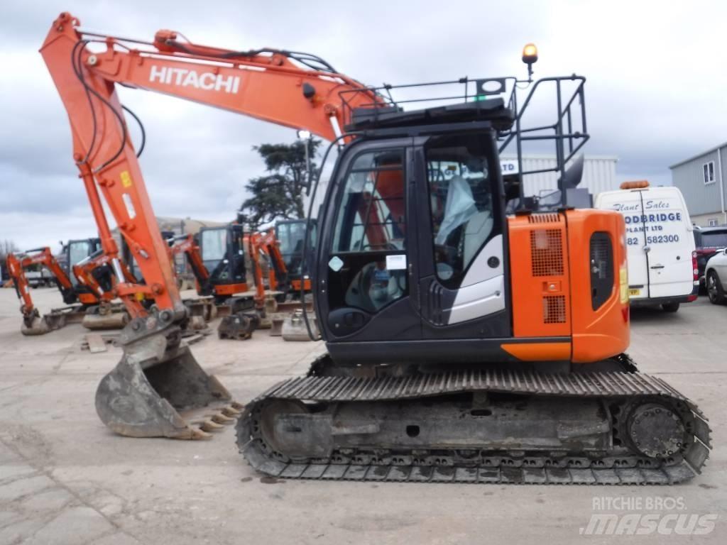 Hitachi ZX 135 US-6 حفارات زحافة