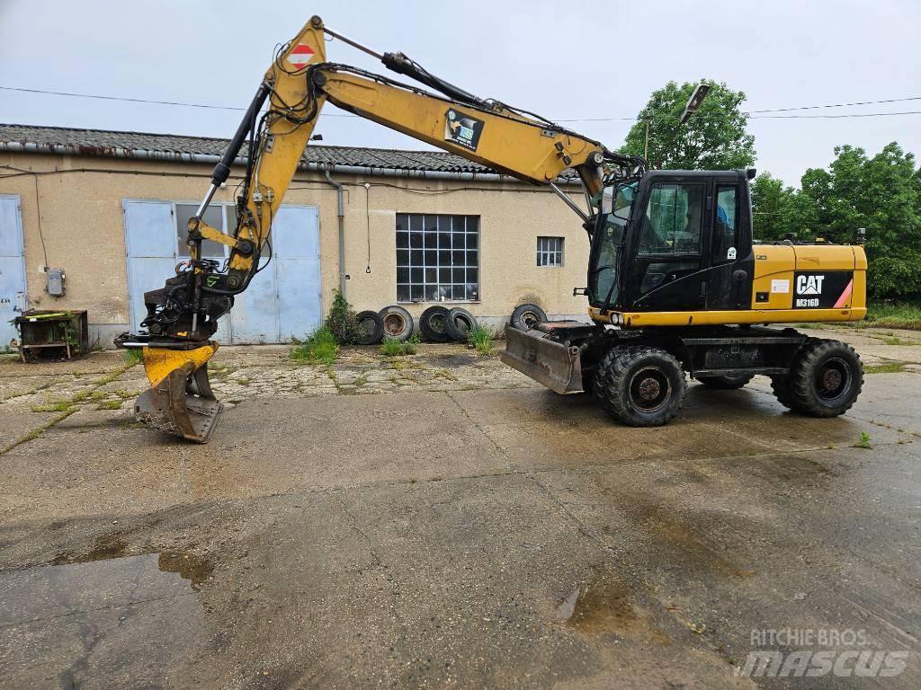CAT M 316 D حفارات بعجل