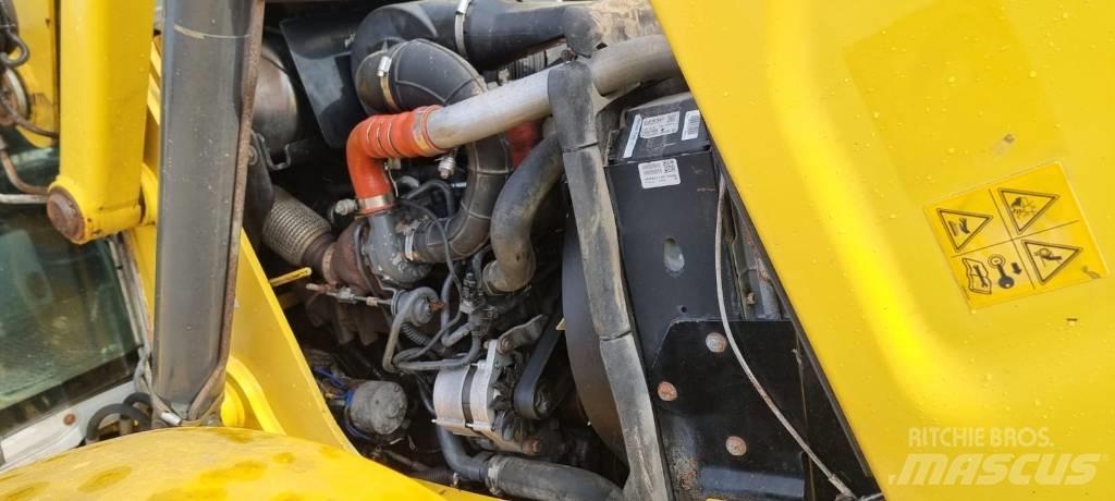 New Holland B 115 C لوادر ذات جرافات عكسية