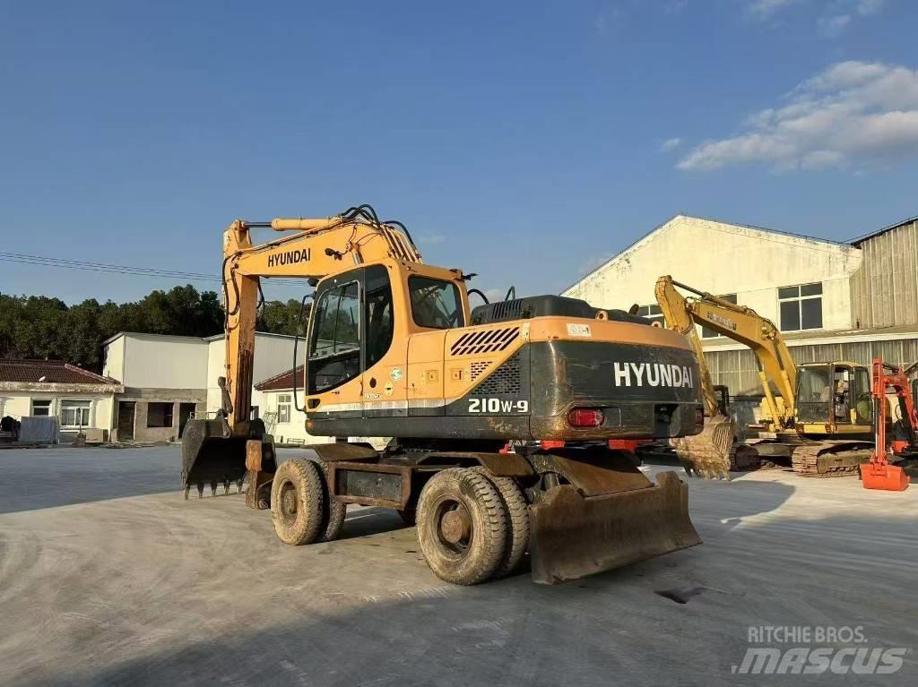 Hyundai 210W-9 حفارات بعجل