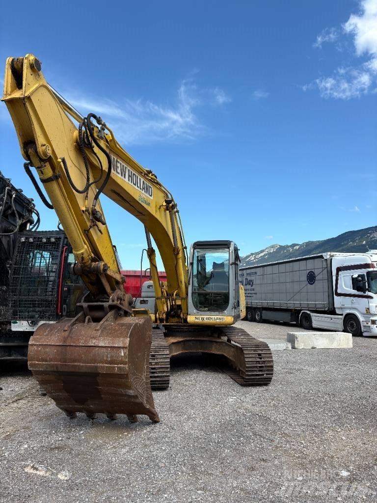 New Holland E 245 B حفارات زحافة