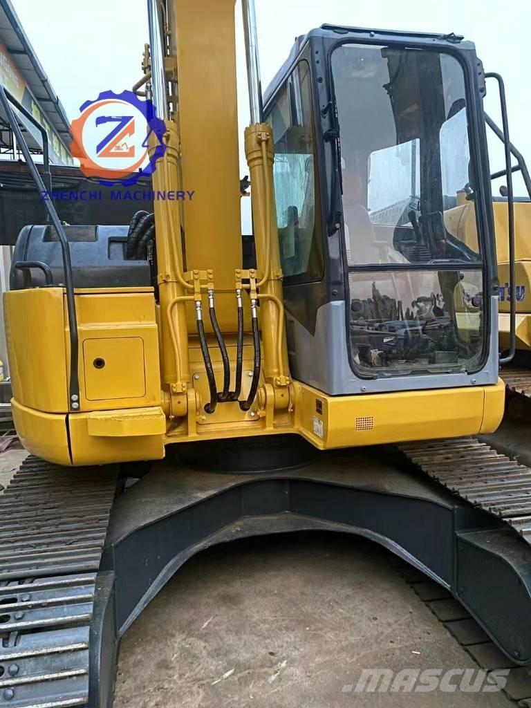 Komatsu PC 128 US حفارات وسط 7 طن - 12 طن