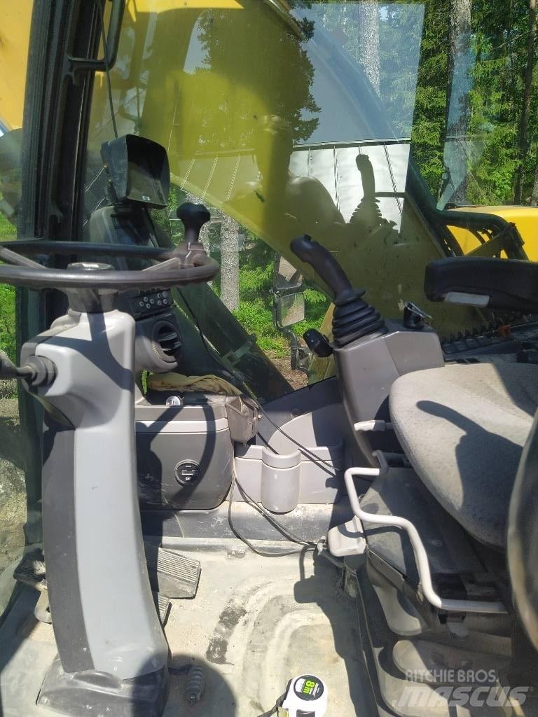 CAT M 313 D حفارات بعجل