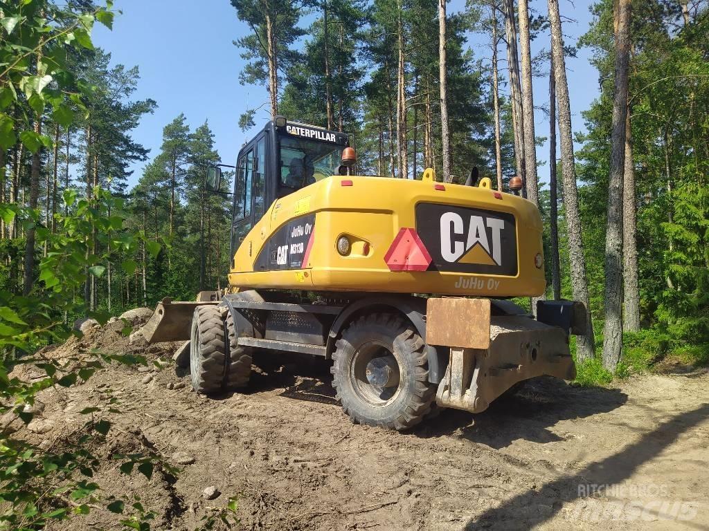 CAT M 313 D حفارات بعجل