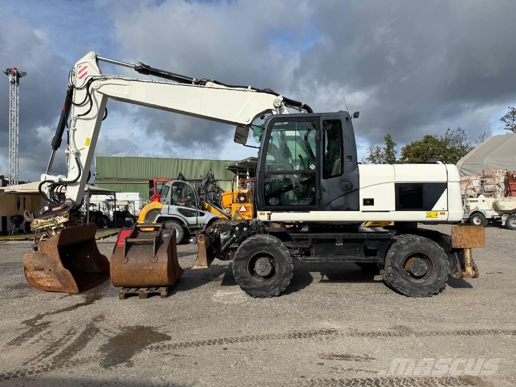 CAT M 316 D حفارات بعجل