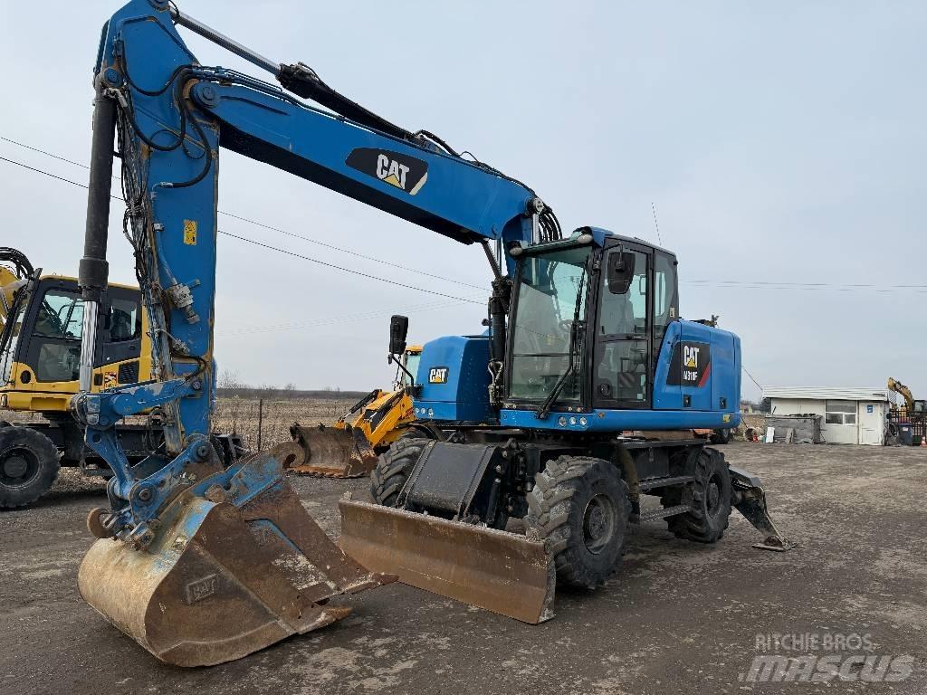 CAT M 318 F حفارات بعجل