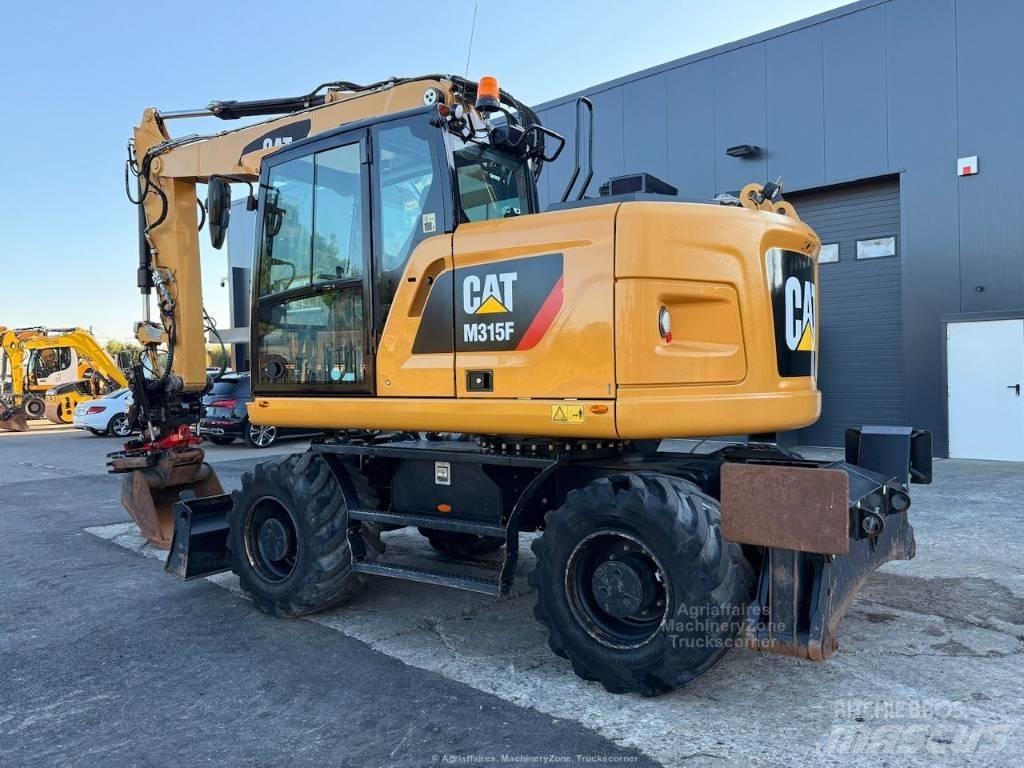 CAT M315F حفارات بعجل