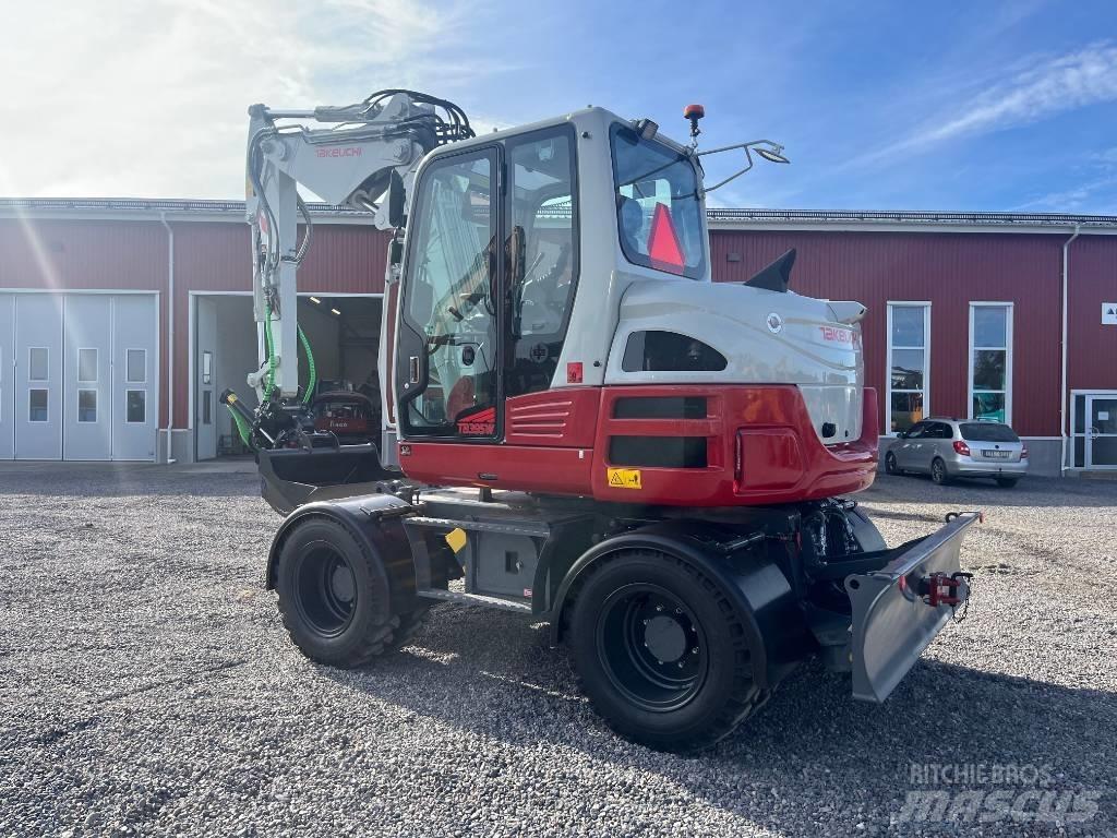 Takeuchi TB 395 W حفارات بعجل