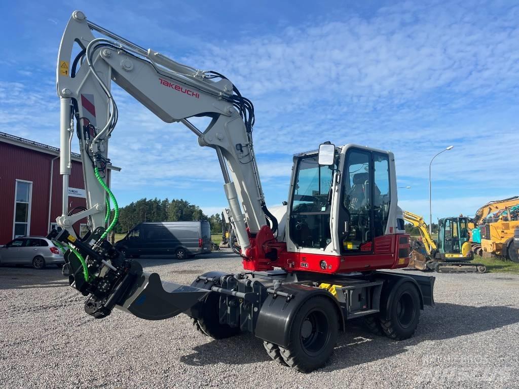 Takeuchi TB 395 W حفارات بعجل
