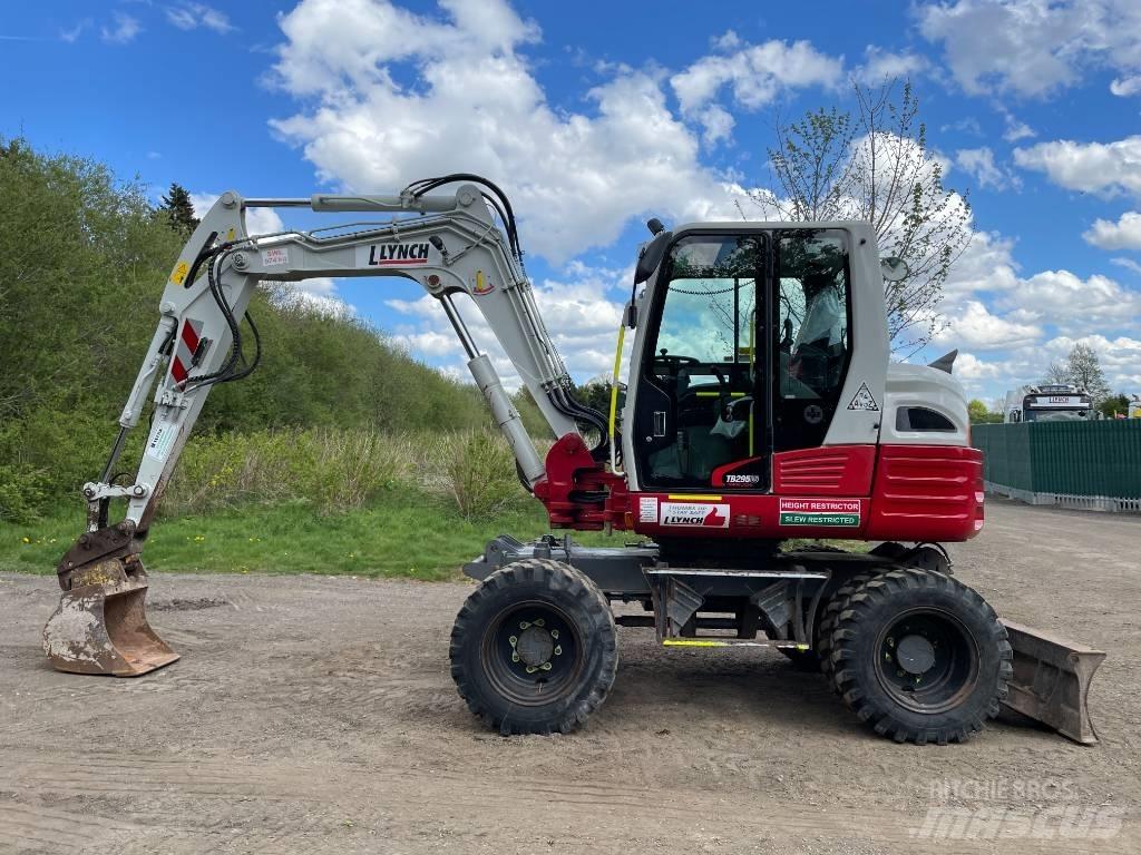 Takeuchi TB 295 W حفارات بعجل