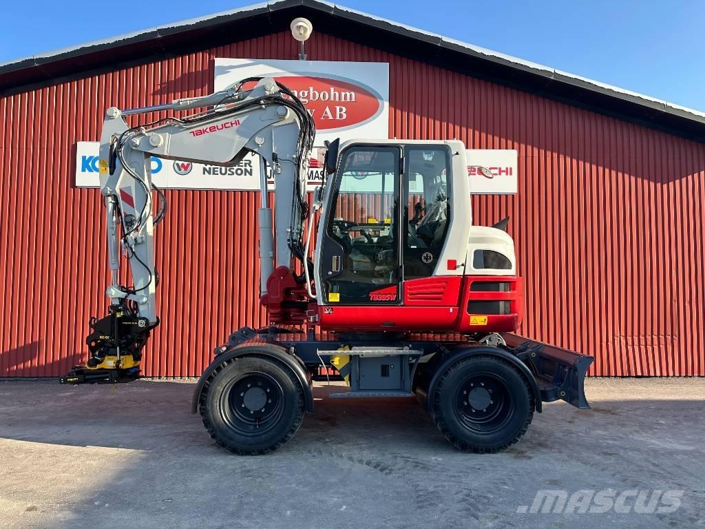 Takeuchi TB 395 W حفارات بعجل