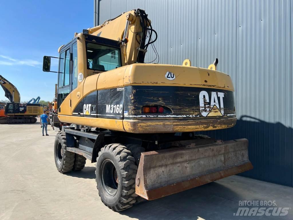 CAT M316C حفارات بعجل