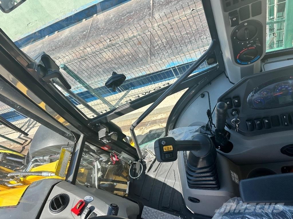 New Holland B 115 B لوادر ذات جرافات عكسية