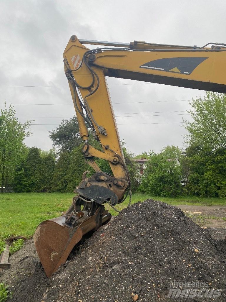 CAT M 316 C حفارات بعجل