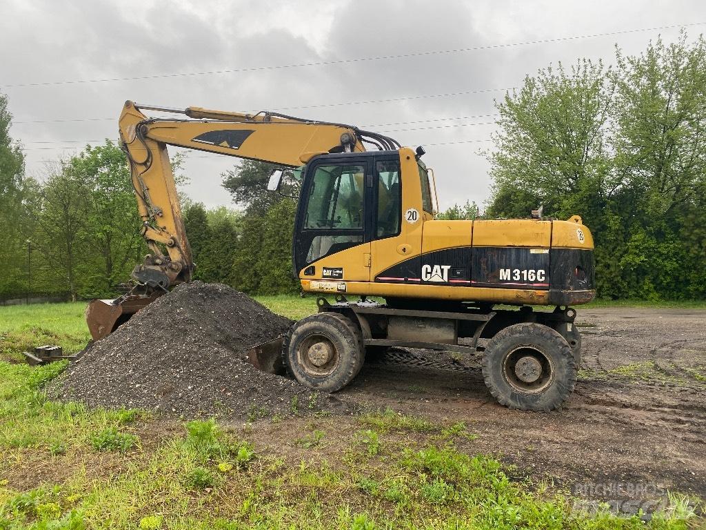 CAT M 316 C حفارات بعجل