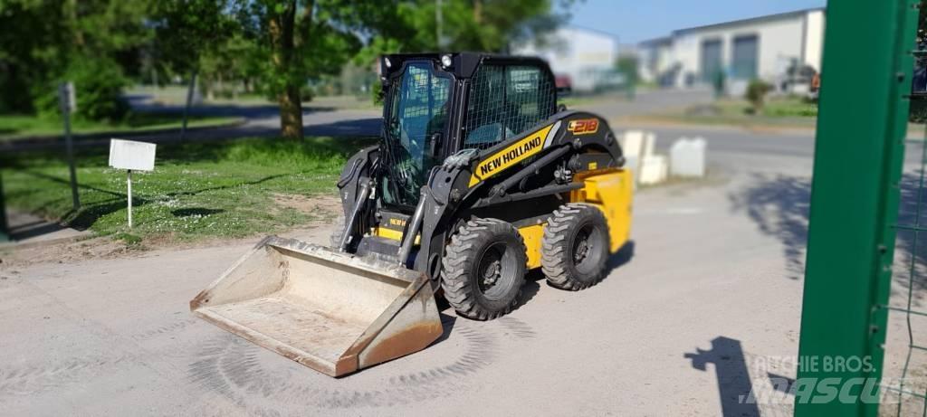 New Holland L218 لوادر انزلاقية التوجيه