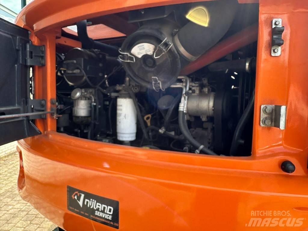 Develon DX 100 W-7 حفارات بعجل
