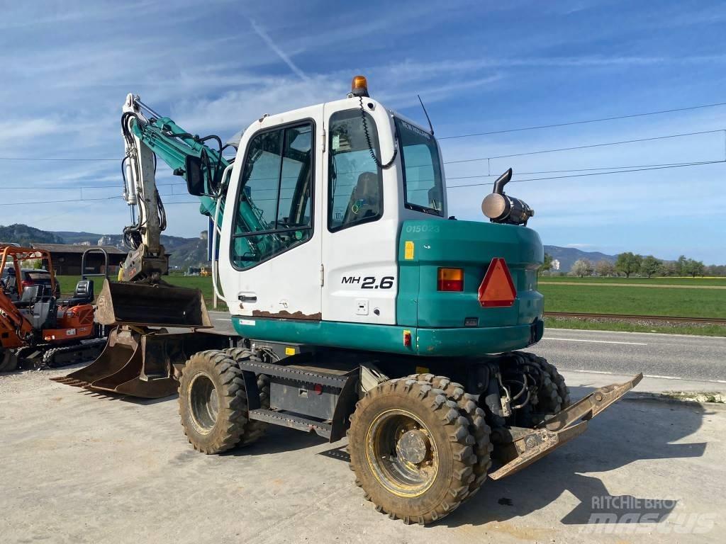 New Holland MH 2.6 حفارات بعجل