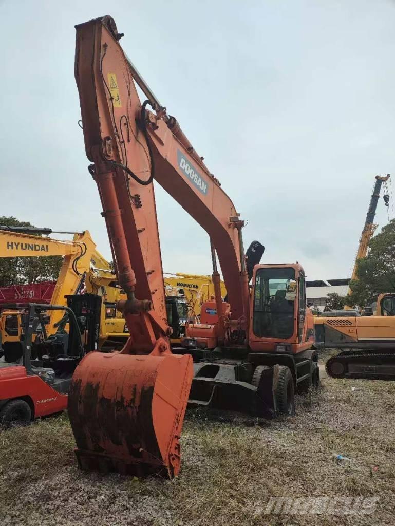 Doosan DH 210 W-7 حفارات بعجل