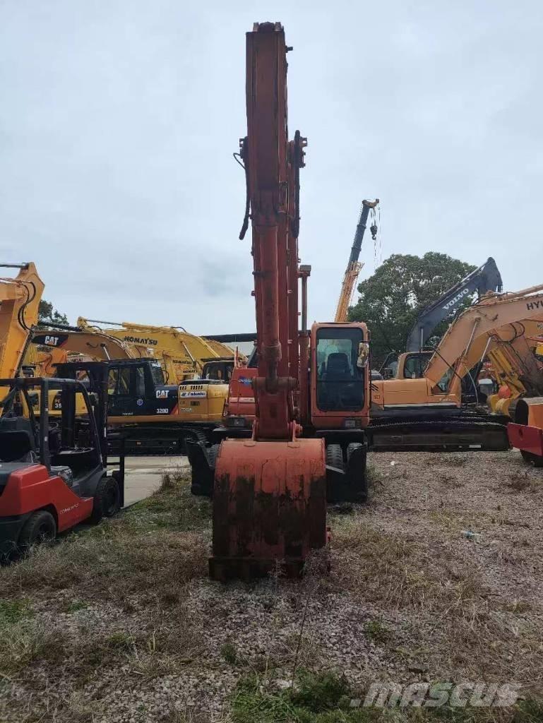 Doosan DH 210 W-7 حفارات بعجل